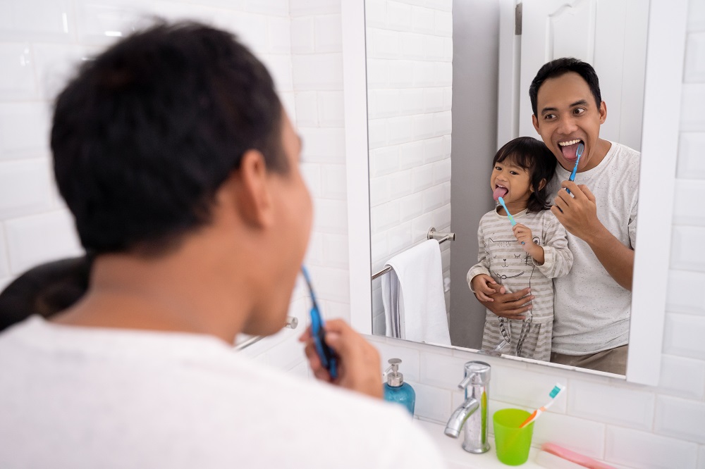 Dad and Daughter dental care
